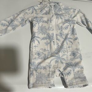 Blue and White tropical Baby Swimsuit with matching bucket hat.